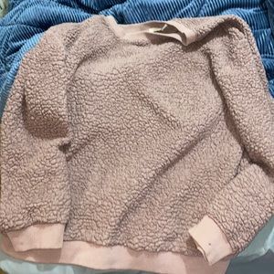 Maroon sweater with small spot on left wrist